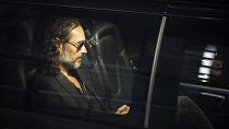 Russell Brand leaves the Troubabour Wembley Park theatre in London after performing a comedy set on Saturday after the allegations were made public