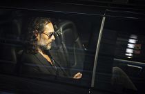 Russell Brand leaves the Troubabour Wembley Park theatre in London after performing a comedy set on Saturday after the allegations were made public