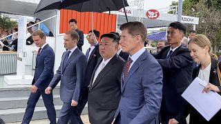 In this photo released by Government of the Russian far eastern region of Primorsky Krai, North Korea's leader Kim Jong Un with Russian officials in Vladivostok, Russia Sept.