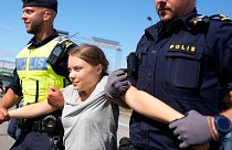 Climate activist Greta Thunberg is detained by police during an action for blocking the entrance to an oil facility in Malmo, Sweden.