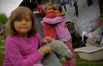 Roma children hug each other in the village of Kallo, Hungary, Sunday, Oct. 11, 2020. 