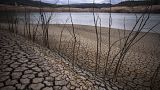 Cracked earth is visible at the Sau reservoir north of Barcelona, Spain, April 18, 2023.
