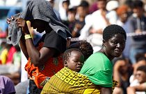 Migrants wait to be transferred from the Lampedusa Island to the mainland, Friday, Sept. 15, 2023.