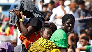 Migrants wait to be transferred from the Lampedusa Island to the mainland, Friday, Sept. 15, 2023.
