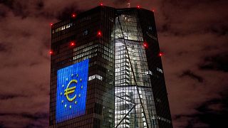 A light installation is projected onto the building of the European Central Bank during a rehearsal in Frankfurt, Germany, Thursday, Dec. 30, 2021.