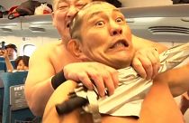 Sumo wrestlers Minoru Suzuki and Sanshiro Takagi fought on the bullet train in a world first on Monday