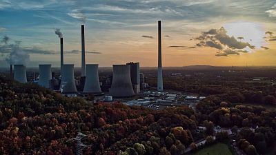 The sun sets behind the coal-fired power plant Scholven of the Uniper energy company in Gelsenkirchen, Germany