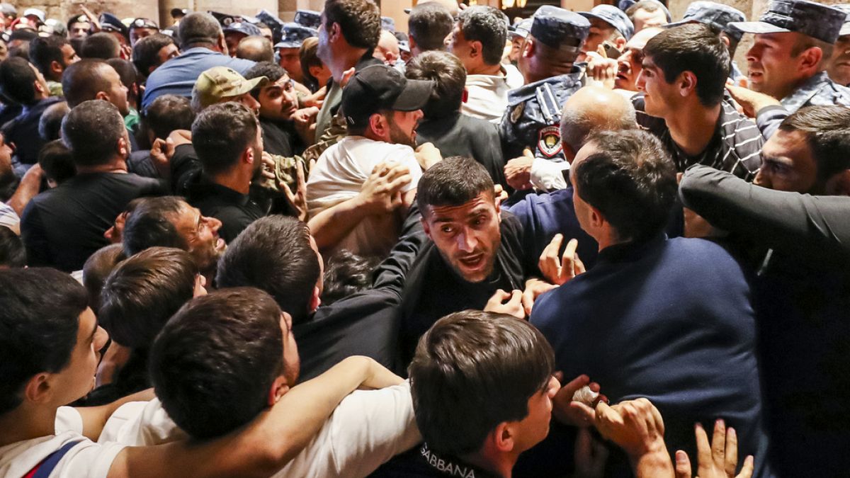 Demonstrators clash with police at the Armenia government building to protest against Prime Minister Nikol Pashinyan, Tuesday, Sept. 19, 2023, in Yerevan, Armenia.