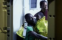 Rescued migrants disembark from a boat on the Italian island of Lampedusa during the evening of Saturday, Sept. 16, 2023.