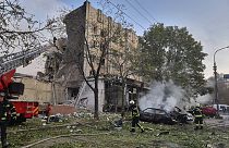 emergency services personnel work to extinguish a fire following a Russian attack in Cherkasy, Ukraine, Thursday, Sept. 21, 2023. 