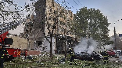 emergency services personnel work to extinguish a fire following a Russian attack in Cherkasy, Ukraine, Thursday, Sept. 21, 2023. 