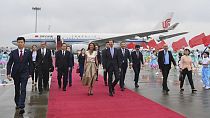 In this photo released by Xinhua News Agency, Syrian President Bashar Assad, center right, and first lady Asma Assad arrive in Hangzhou, China, Thursday, Sept. 21, 2023. 