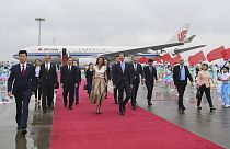 In this photo released by Xinhua News Agency, Syrian President Bashar Assad, center right, and first lady Asma Assad arrive in Hangzhou, China, Thursday, Sept. 21, 2023.
