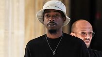 French rapper Mohamed Sylla, aka MHD, arrives for the start of his and eight other men's trial for a murder committed during a brawl between two rival gangs in Paris in 2018.