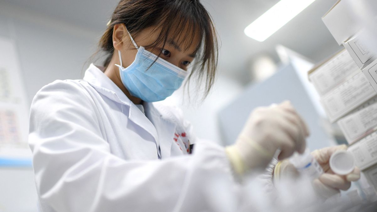 A laboratory technician conducts an artificial intelligence (AI)-based cervical cancer screening at a test facility in Wuhan, China. 2023