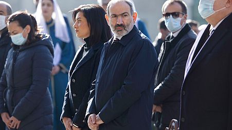 Armenia's Prime Minister Nikol Pashinian, centre, and his wife Anna Akobian, left of him, in 2020.