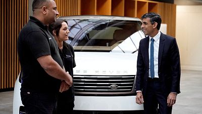 Britain's Prime Minister, Rishi Sunak meets workers during a visit to Land Rover for an announcement on an electric car battery factory on 19 July 2023 in Warwick, England.