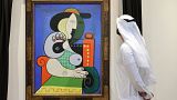 A visitor looks at Pablo Picasso’s painting 'Femme à la montre' displayed for viewing at Sotheby’s Dubai on September 25, 2023.