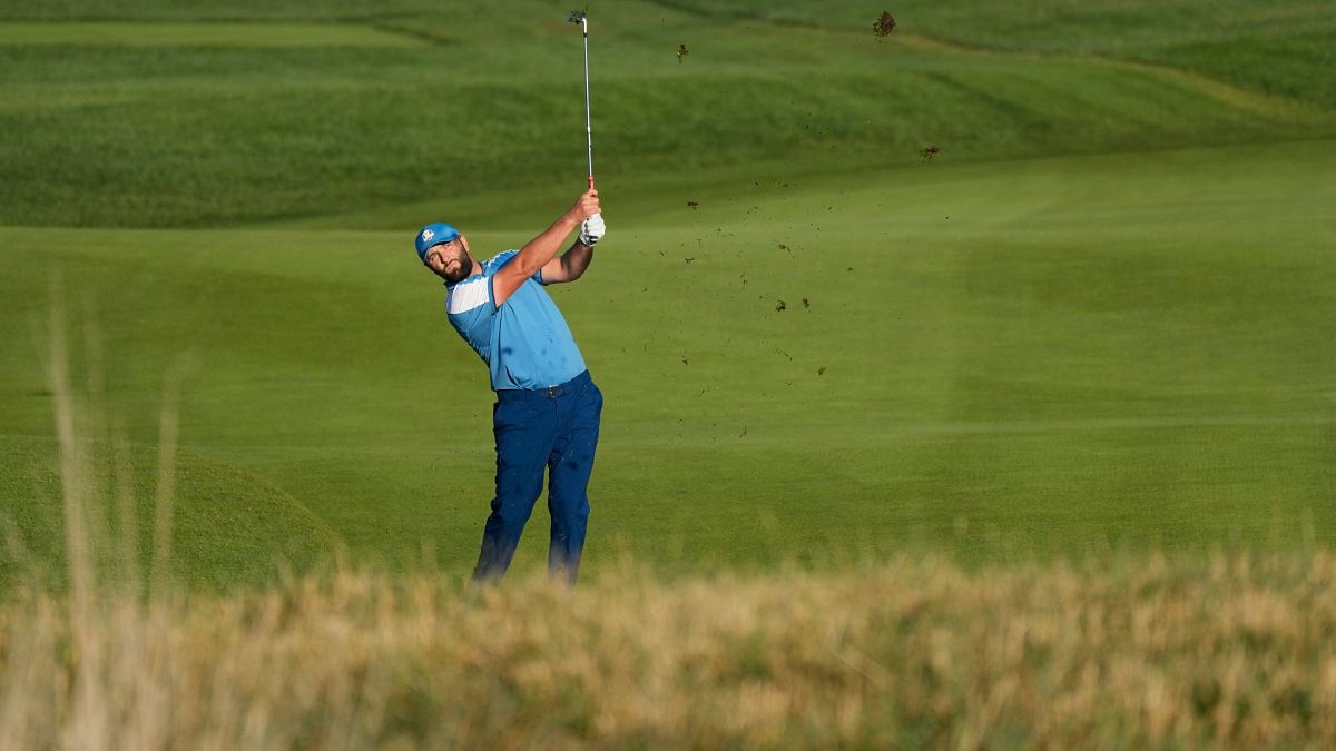 Europe's Jon Rahm play his shot at the Ryder Cup golf tournament at the Marco Simone Golf Club in Guidonia Montecelio, Italy, Friday, Sept. 29, 2023. 