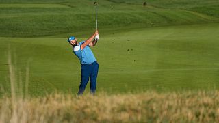Europe's Jon Rahm play his shot at the Ryder Cup golf tournament at the Marco Simone Golf Club in Guidonia Montecelio, Italy, Friday, Sept. 29, 2023. 