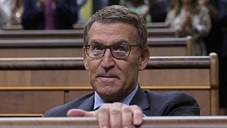 The leader of Spain's conservatives Alberto Feijoo leaves an investiture session at the Spanish parliament in Madrid.