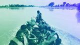 Rescue workers use a boat to evacuate villagers from a flooded area of Bahawalnagar district in Pakistan's Punjab province, August 2023