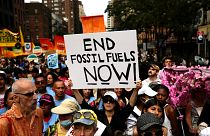 Climate activists attend a rally to end fossil fuels, in New York.