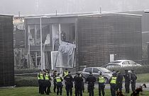 Police stand on the site of a powerful explosion that occurred early Thursday morning Sept. 28, 2023, in a housing area in Storvreta outside Uppsala, Sweden.
