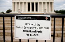 A sign reading "Because of the Federal Government SHUTDOWN All National Parks are Closed" is posted on a barricade in front of the Lincoln Memorial in Washington in 2013.