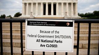 A sign reading "Because of the Federal Government SHUTDOWN All National Parks are Closed" is posted on a barricade in front of the Lincoln Memorial in Washington in 2013.