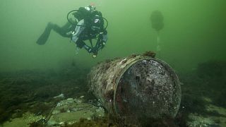 A diver approaches an unexploded munition in the Baltic