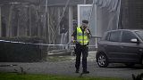 A police officer stands on the site of a powerful explosion that occurred early Thursday morning Sept. 28, 2023.