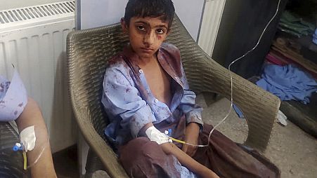 In this photo provided by District Police Office, a boy injured in a bomb explosion receives treatment at a hospital, in Mastung near Quetta, Pakistan, Friday, Sept. 29, 2023