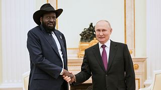 South Sudan President Salva Kiir Mayardit poses for a photo with Putin prior to their talks at the Kremlin in Moscow, Russia