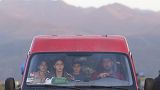 Ethnic Armenians from Nagorno-Karabakh sit inside a minibus on their way to Armenia's Goris in Syunik region, Armenia, on Thursday, Sept. 28, 2023. 