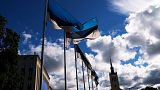 Estonian national flags flutter in the wind at Freedom Square in Tallinn, Estonia.