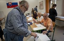 A voter casts his ballot at a polling station in Bratislava, Slovakia, Saturday, Sept. 30, 2023.