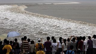 Crowds watch world's largest tidal bore along the Qiantang river, September 30th 2023