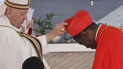 Newly elected Cardinal Protase Rugambwa, coadjutor archbishop of Tabora, Tanzania, receives his biretta from Pope Francis in St. Peter's Square at The Vatican, Sept. 30, 2023
