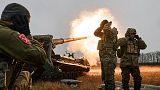 FILE - Ukrainian soldiers fire a Pion artillery system at Russian positions near Bakhmut, Donetsk region, Ukraine, Friday, Dec. 16, 2022.