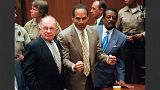 OJ Simpson celebrates after being found 'not guilty' in the murder of his ex-wife and her friend on 3 October 1995.