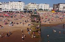 Beach-goers cool off in water to escape the heat in Brighton, UK, 9 September 2023. 