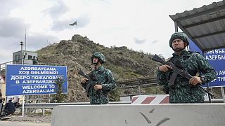 Azerbaijani servicemen guard the Lachin checkpoint on the in Azerbaijan, Sunday, Oct. 1, 2023.