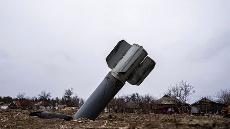 FILE - The tail of a missile sticks out in a residential area in Yahidne, near of Chernihiv, Ukraine, Tuesday, April 12, 2022.