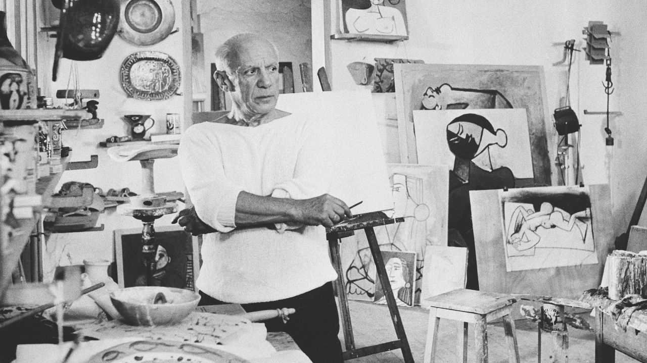 Artist Pablo Picasso poses in his studio in Vallauris, France, 23 October 1953.
