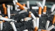 FILE - This March 28, 2019 photo shows cigarette butts in an ashtray in New York.