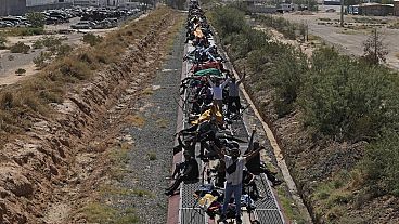Migrants, mostly from Venezuela, traveling on a train.  