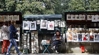 Why are Paris second-hand booksellers being asked to leave the banks of the River Seine? 