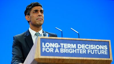 UK's Prime Minister Rishi Sunak pauses during his speech at the Conservative Party annual conference