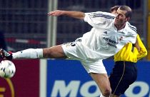 Real Madrid's Zinedine Zidane struggles with Borussia Dortmund's Stefan Reuter during the Champions League second Phase group C match, 2003.